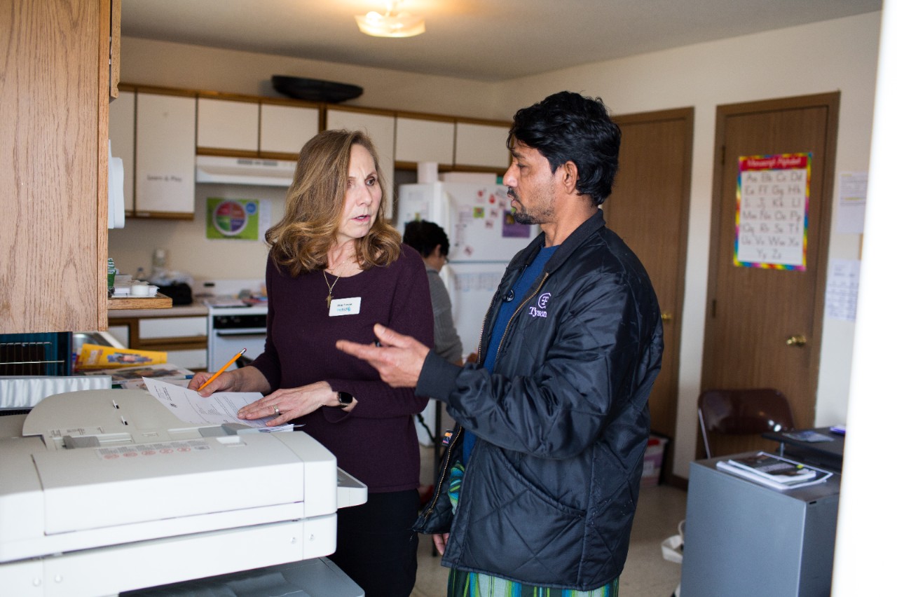 Birgit Lemke assists Ziaur Rahman with his tax questions at the LiveWell Finney County Neighborhood Learning Center in Garden City, Kansas. Rahman is a refugee from Myanmar and works at the Tyson Fresh Meats meatpacking plant.  LiveWell helps refugees and immigrants with health care, housing and job applications and offers classes in English, nutrition and other life skills.   Many of the Myanmar refugees they serve are from opposing ethnic groups.