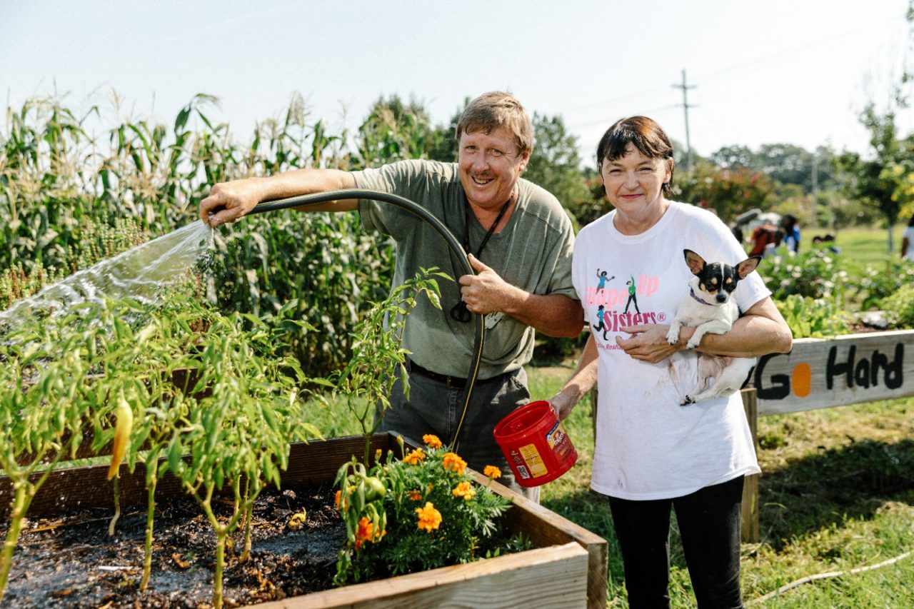 Vicksburg, MS - August 4, 2017 - Barry and Sharon Batchelor water their plants at Vicksburg Community Garden.