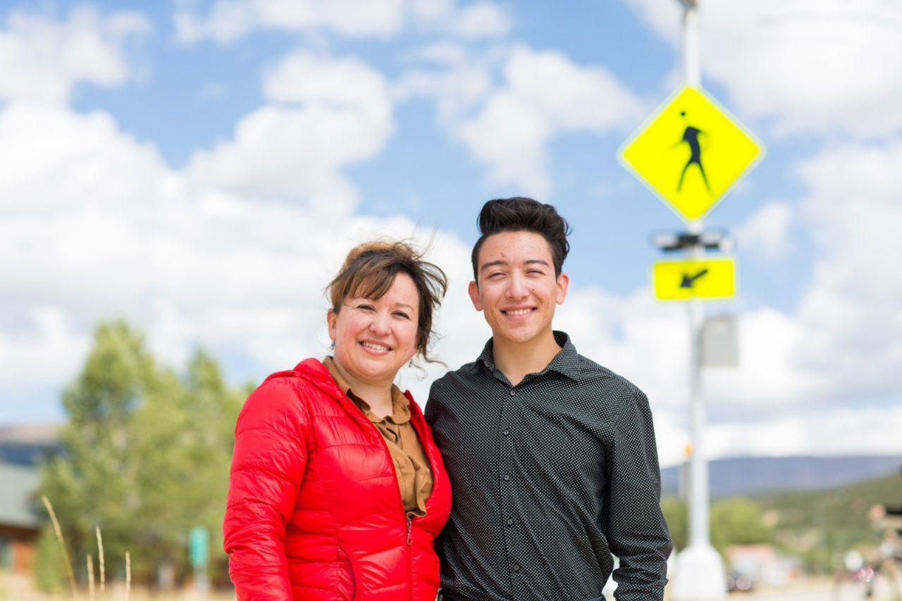 Cristina Reveles and her 19 year old son Brayhan Reveles in front of the new pedestrian crosswalk that connects Colorado Mountain College with Lake County High School across Highway 24 in Leadville, Colorado.  The project was initiated by Brayhan, a Colorado Mountain College student and Healthy Eating/Active Living coordinator at Lake County Build a Generation and his mother Cristina, who has advocated for safe routes to schools since Brayhan was a child.