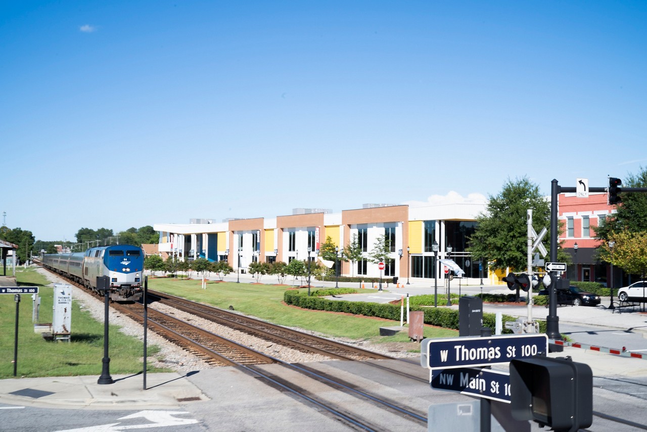 A train traveling through a small town.